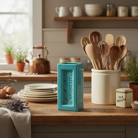 Teal rectangular vase with 'Outwood Brick Works Manchester' branding on a white background