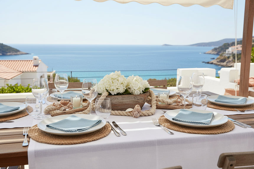 Folded light blue napkin with white trim on a white background