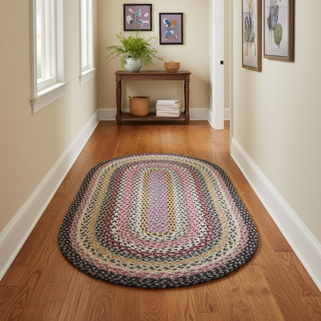 Multicolored braided rug on a white background