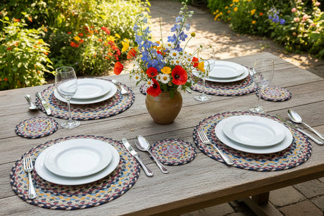 Round braided placemats with multicolor pattern on a white background