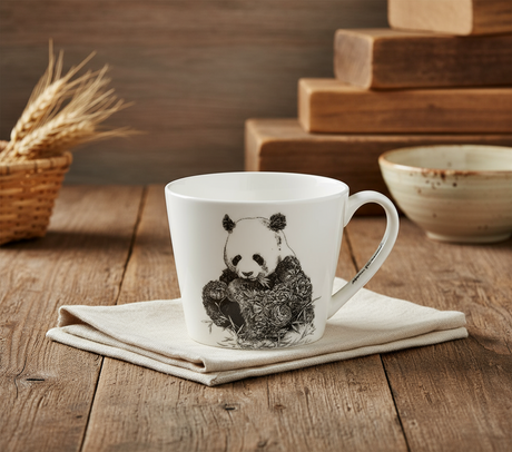 White mug with a panda design on a white background