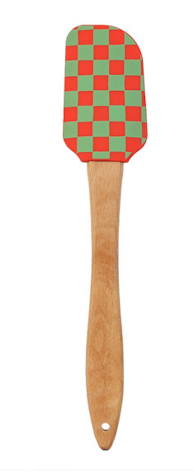 Spatula with a checkered red and green head and wooden handle on a white background