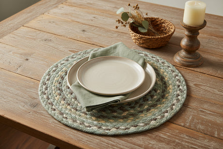 Round braided placemat with multicolor pattern on a white background