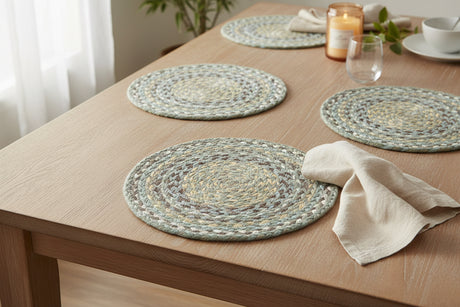 Round braided placemats with multicolor pattern on a white background