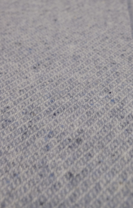 Close-up of a textured sky blue  throw