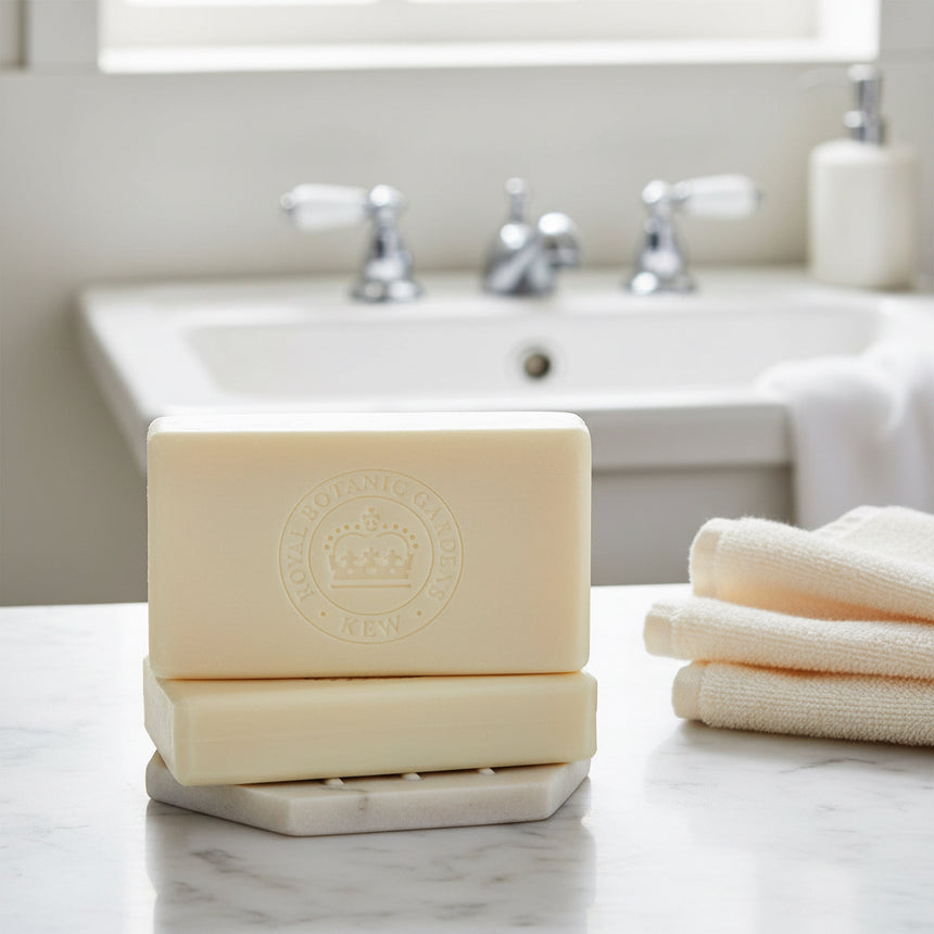 Bar of soap with a brand logo on a marble surface