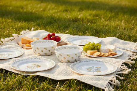 Set of four ceramic bowls with floral pattern on a white background