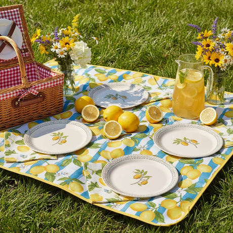 Set of four round plates with lemon design on a white background