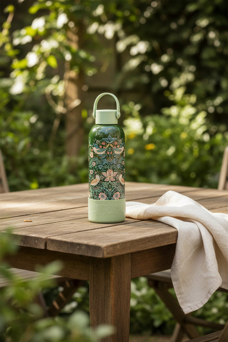 Floral-patterned water bottle with green lid and base on a white background