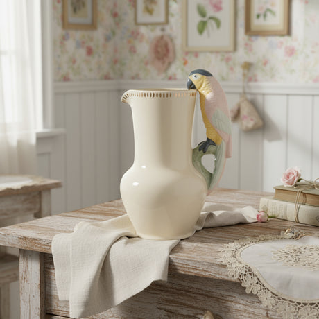 Ceramic pitcher with a bird design on a white background