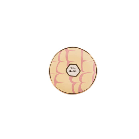 Round trinket dish with pink marbled design and 'Tea Bags' label on a white background