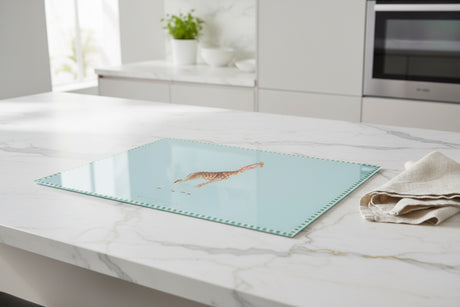 glass worktop saver with a giraffe design on a light blue background