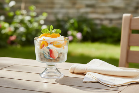 Decorative glass cup with a design on a white background