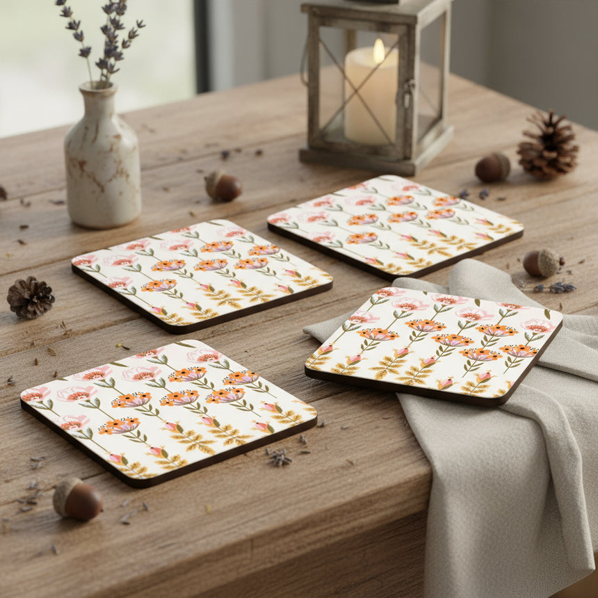 Four floral patterned coasters on a white background