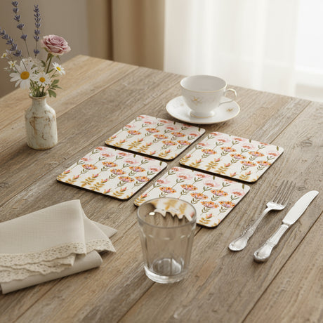 Four floral patterned coasters on a white background