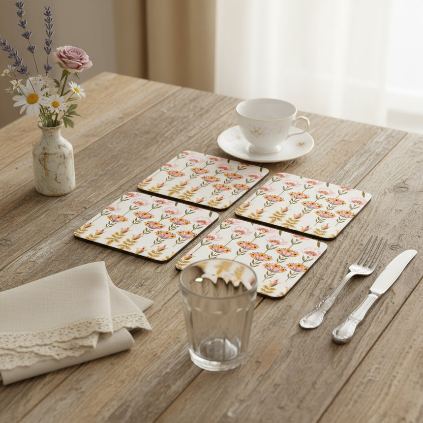 Four floral patterned coasters on a white background