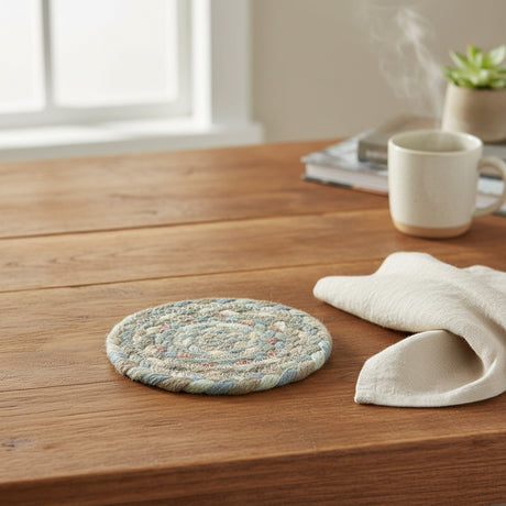 Round braided coaster  with multicolor pattern on a white background