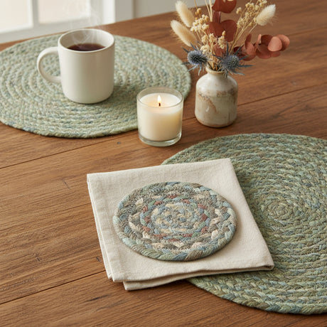 Round braided  coaster with multicolor pattern on a white background